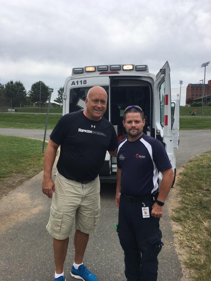 Special Events Coordinator, EMT Shane Sawyer, taking a minute to pose with the 1983 World Series winning Shortstop, Cal Ripken, Jr. MedCare provides the first-aid at all Aberdeen Ironbirds games.